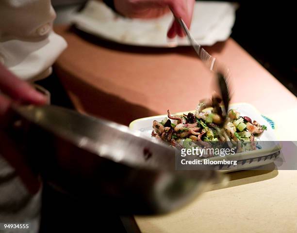 Chef Dana Gerson prepares a salad with calamari and smoked chickpeas at Terroir in New York, U.S., on Friday Dec. 12, 2008. Terroir is located at 413...