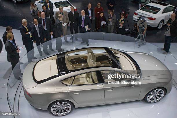 General Motors Corp. Executives, from top left, Gary Cowger, head of manufacturing and labor, unidentified, Bob Lutz, vice chairman, Ed Welburn, vice...