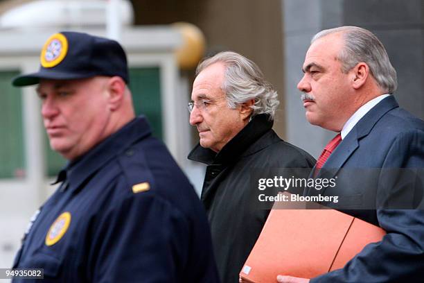 Bernard Madoff, founder of Bernard L. Madoff Investment Securities LLC, center, leaves federal court after a bail hearing in New York, U.S., on...