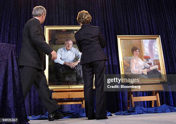 President George W. Bush, left, and first lady Laura Bush view their official portraits at an unveiling at the National Portrait Gallery in...