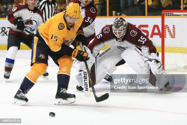 Nashville Predators right wing Craig Smith tries to gain control of the loose puck in front of Colorado Avalanche goalie Andrew Hammond during Game...