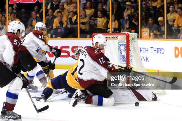 Colorado Avalanche defenseman Patrik Nemeth and Avalanche goalie Andrew Hammond defend against Nashville Predators right wing Craig Smith during Game...