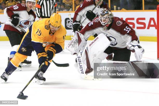 Nashville Predators right wing Craig Smith pursues the loose puck in front of Colorado Avalanche goalie Andrew Hammond during Game Five of Round One...