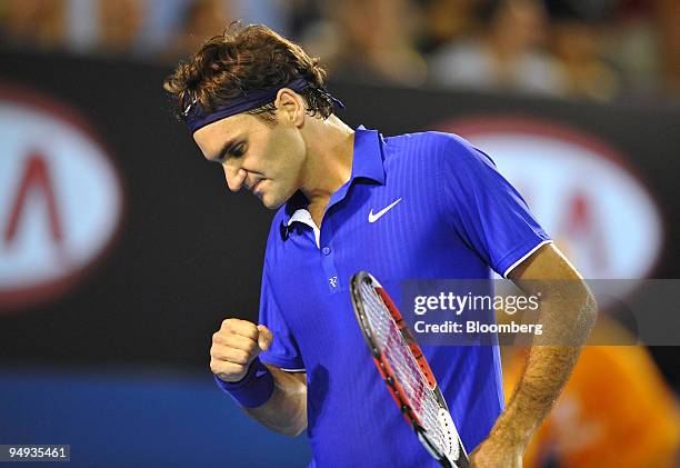 Roger Federer of Switzerland gestures after winning a point against Andy Roddick of the U.S. On day 11 of the Australian Open Tennis Championship, in...