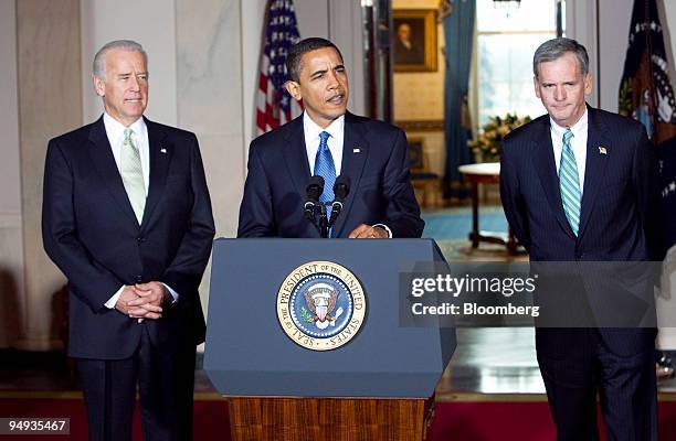 President Barack Obama, center, is flanked by Vice President Joseph Biden, left, and Senator Judd Gregg of New Hampshire as he makes an announcement...