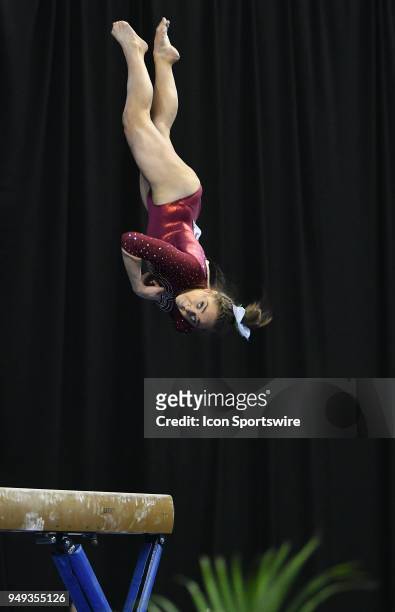 Peyton Ernst of Alabama dismounts from the beam during the NCAA Women's Gymnastics National Championship first round on April 20 at Chaifetz Arena,...