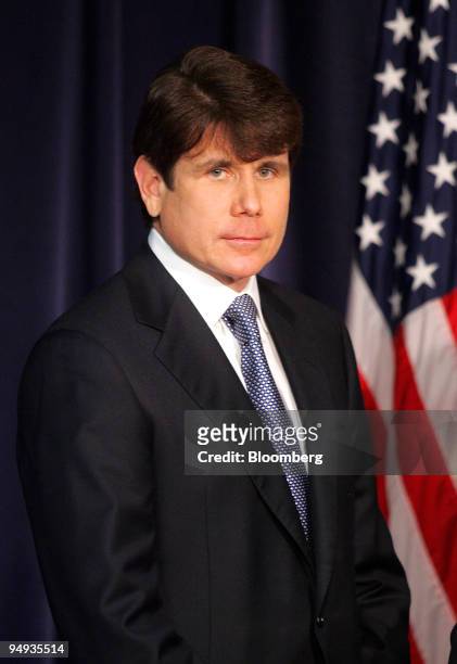 Rod Blagojevich, governor of Illinois, stands near the podium as Roland Burris, former Illinois attorney general, speaks at a news conference in...
