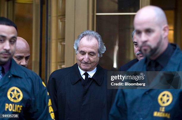 Bernard Madoff, president and founder of Bernard L. Mandoff Investment Securities LLC, walks out of Manhattan federal court in New York, U.S., on...