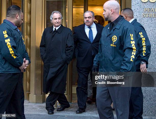 Bernard Madoff, president and founder of Bernard L. Mandoff Investment Securities LLC, walks out of Manhattan federal court in New York, U.S., on...