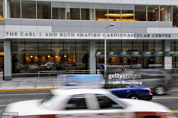 Cars pass by the Brigham and Women's Hospital Carl J. And Ruth Shapiro Cardiovascular Center in Boston, Massachusetts, U.S., on Thursday, Jan. 8,...