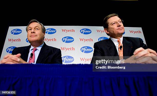 Bernard Poussot, chairman and chief executive officer of Wyeth, right, and Jeffrey Kindler, chairman and chief executive officer of Pfizer Inc.,...