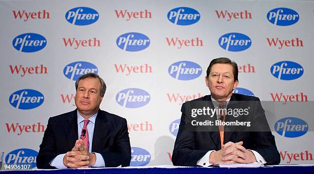 Bernard Poussot, chairman and chief executive officer of Wyeth, right, and Jeffrey Kindler, chairman and chief executive officer of Pfizer Inc.,...