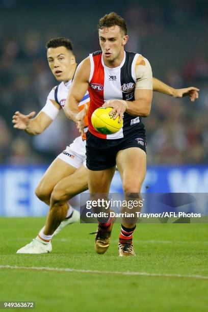 Luke Dunstan of the Saints runs with the ball during the round five AFL match between the St Kilda Saints and the Greater Western Sydney Giants at...