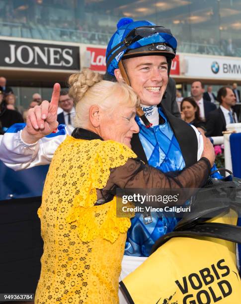 Trainer Udyta Clarke hugs Patrick Moloney after riding Rich Charm to win Race 8 during Melbourne Racing at Caulfield Racecourse on April 21, 2018 in...