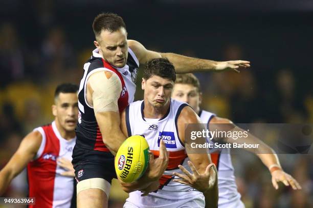 Jonathon Patton of the Giants and Nathan Brown of the Saints compete for the ball during the round five AFL match between the St Kilda Saints and the...