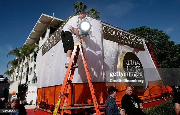 Technician adjusts lighting before the 66th Annual Golden Globes Awards in Beverly Hills, California, U.S., on Sunday, Jan. 11, 2009. Heath Ledger...