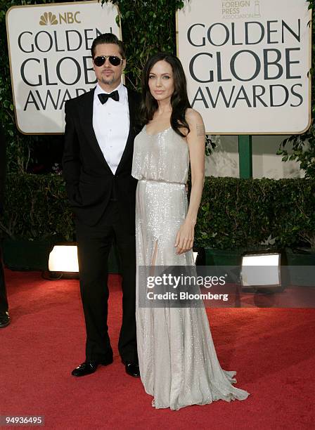 Actors Brad Pitt, left, and Angelina Jolie arrive for the 66th Annual Golden Globe Awards in Beverly Hills, California, U.S., on Sunday, Jan. 11,...