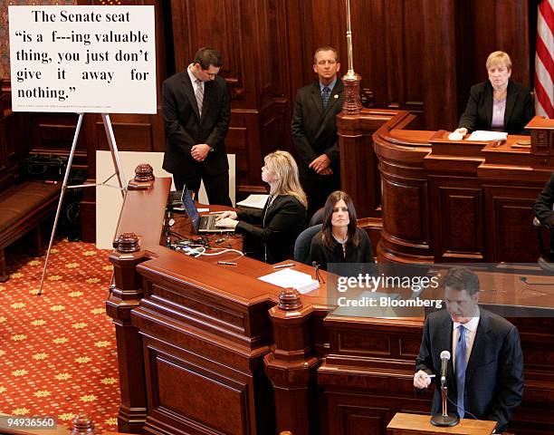 Acting prosecutor David Ellis, right, uses a visual aid, left, as he makes his closing argument before the Illinois state senate at the impeachment...