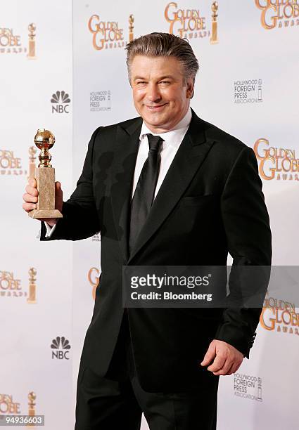 Actor Alec Baldwin poses with his award for Best Performance by an Actor in a Television Series for "30 Rock" at the 66th Annual Golden Globes Awards...