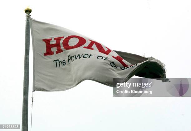 The Honda company flag flies from a flag pole at the Honda car production plant in Swindon, U.K., on Friday, Jan. 30, 2009. Honda Motor Co., Japan?s...