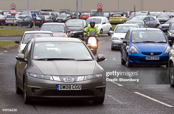 Honda workers leave the Honda car production plant at the end of the morning shift in Swindon, U.K., on Friday, Jan. 30, 2009. Honda Motor Co.,...