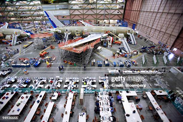 Employees work on the assembly line of the Boeing Co. 787 Dreamliner at the company's manufacturing plant in Everett, Washington, U.S., on Friday,...