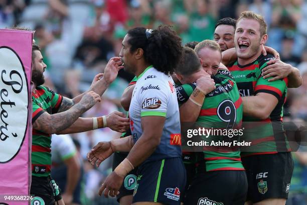 Rabbitohs players celebrate a try during the round seven NRL match between the South Sydney Rabbitohs and the Canberra Raiders at Central Coast...