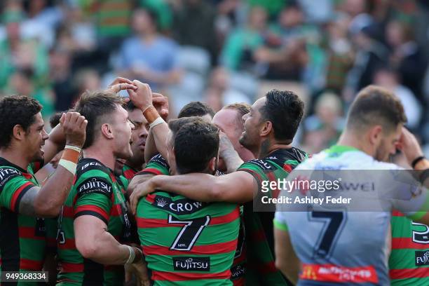 Rabbitohs players celebrate a try during the round seven NRL match between the South Sydney Rabbitohs and the Canberra Raiders at Central Coast...