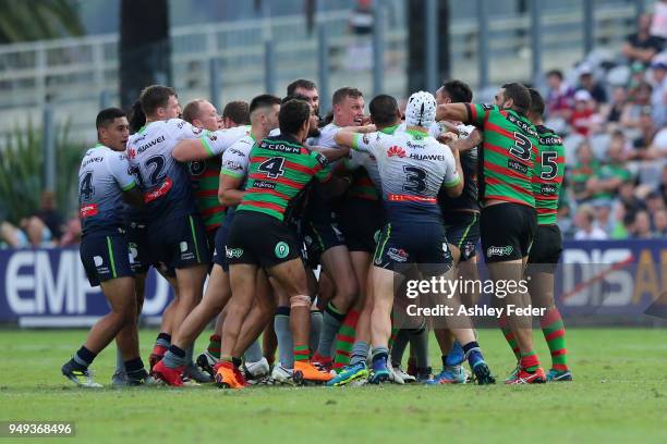 Rabbitohs and Raiders players during an altercation during the round seven NRL match between the South Sydney Rabbitohs and the Canberra Raiders at...