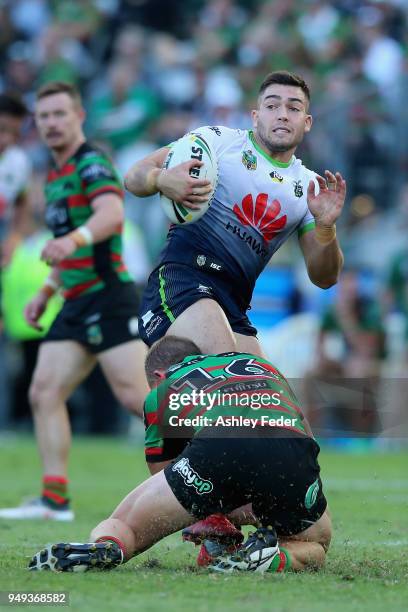 Nikola Cotric of the Raiders is tackled by the Rabbitohs defence during the round seven NRL match between the South Sydney Rabbitohs and the Canberra...