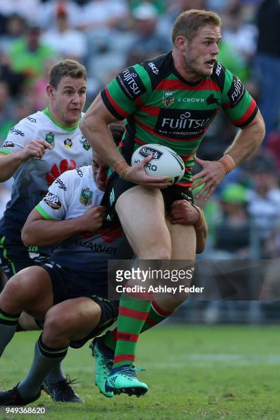 George Burgess of the Rabbitohs is tackled by the Raiders defence during the round seven NRL match between the South Sydney Rabbitohs and the...