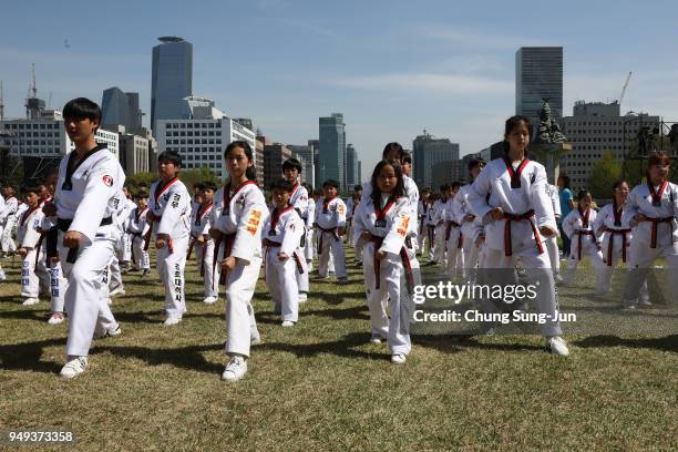 About 10,000 South Koreans perform martial arts Taekwondo at the national assembly on April 21, 2018 in Seoul, South Korea. The event organized by a...