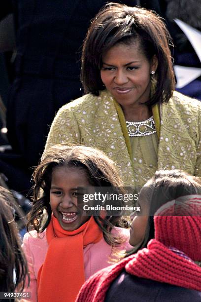 The family of U.S. President Barack Obama, from left, daughter Sasha, wife Michelle, and daughter Malia prepare to depart after Obama's inauguration...