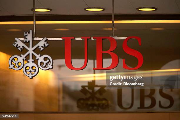 The UBS AG logo hangs on the bank's headquarters on Paradeplatz in Zurich, Switzerland, on Saturday, Feb. 7, 2009. UBS AG, Switzerland's largest...