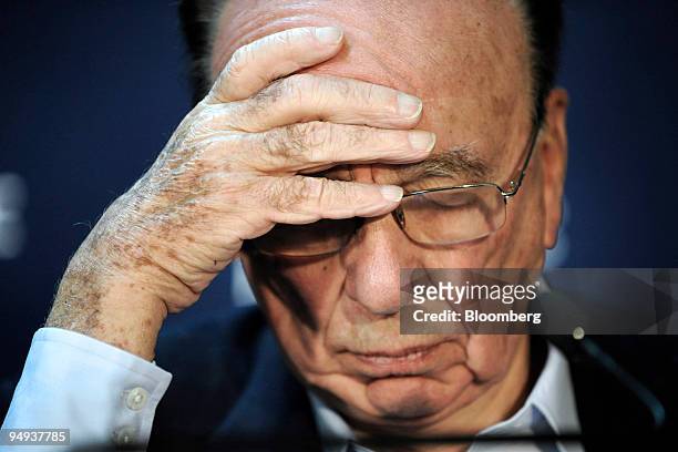 Rupert Murdoch, chairman and chief executive officer of News Corp., listens during the opening press conference on day one of the World Economic...