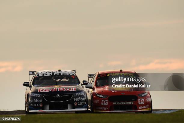 Jamie Whincup drives the Red Bull Holden Racing Team Holden Commodore ZB is passed by Scott McLaughlin drives the Shell V-Power Racing Team Ford...