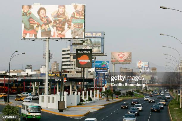 Advertising billboards sit above traffic in Lima, Peru, on Sunday, April 5, 2009. Peru's stock market, Latin America's worst performer last year, is...