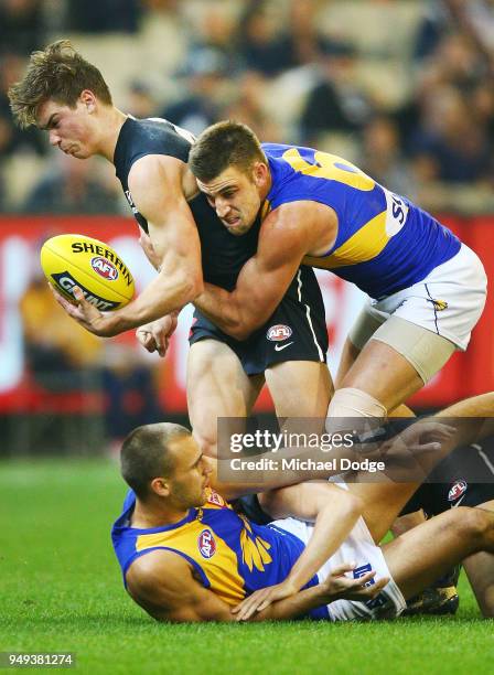 Elliot Yeo of the Eagles tacles Paddy Dow of the Blues during the round five AFL match between the Carlton Blues and the West Coast Eagles at...