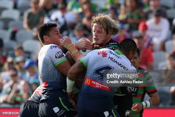 Tom Burgess of the Rabbitohs is tackled by the Raiders defence during the round seven NRL match between the South Sydney Rabbitohs and the Canberra...
