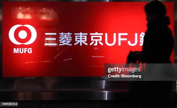 Pedestrian walks past a Bank of Tokyo Mitsubishi UFJ branch in Tokyo, Japan, on Thursday, Jan. 15, 2009. Mitsubishi UFJ Financial Group Inc., Japan's...