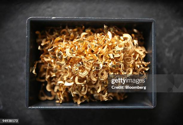 Box of gold shavings waits to be processed at Metal-Art Ltd., in Budapest, Hungary, on Thursday, Feb. 12, 2009. Gold's rally in both dollars and...