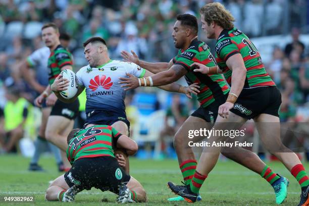 Nikola Cotric of the Raiders is tackled by the Rabbitohs defence during the round seven NRL match between the South Sydney Rabbitohs and the Canberra...