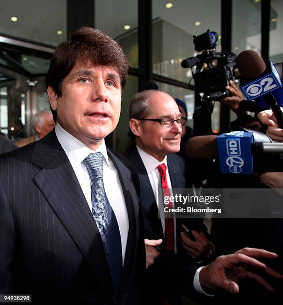 Rod Blagojevich, former governor of Illinois, left, speaks to the media as he leaves Dirksen Federal Building following his arraignment in Chicago,...