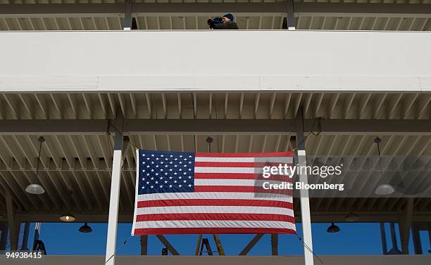 Cameraman shoots footage from a viewing stand during inauguration preparations along Pennsylvania Avenue in Washington, D.C., U.S., on Friday, Jan....