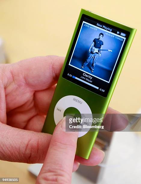 Customer looks at a new iPod Nano at the Apple store in Salt Lake City, Utah, U.S., on Wednesday, April 22, 2009. Apple Inc. Reported second-quarter...