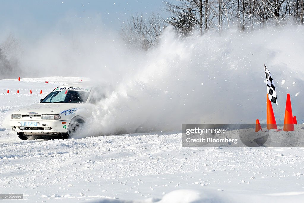 A rally tuned Nissan turns out of a snow bank on the racetra