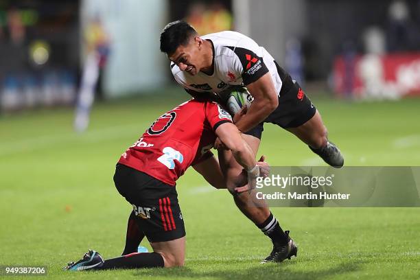 Kenki Fukuoka of the Sunwolves is tackled by Mike Delany of the Crusaders during the round 10 Super Rugby match between the Crusaders and the...
