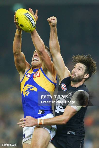 Jake Waterman of the Eagles and Dale Thomas of the Blues compete for the ball during the round five AFL match between the Carlton Blues and the West...