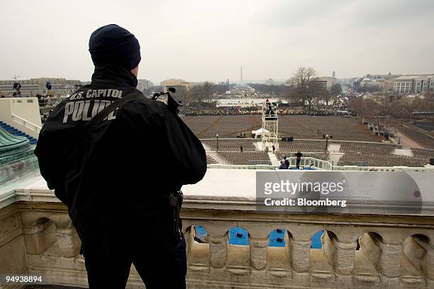 Capitol Police officer stands guard as final preparations continue outside the U.S. Capitol for the inauguration of President-elect Barack Obama in...