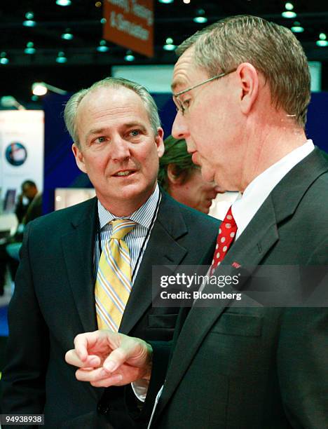 James "Jim" Taylor, chief executive officer of General Motors Corp.'s Hummer unit, left, speaks with Gary Rogers, president and chief executive...